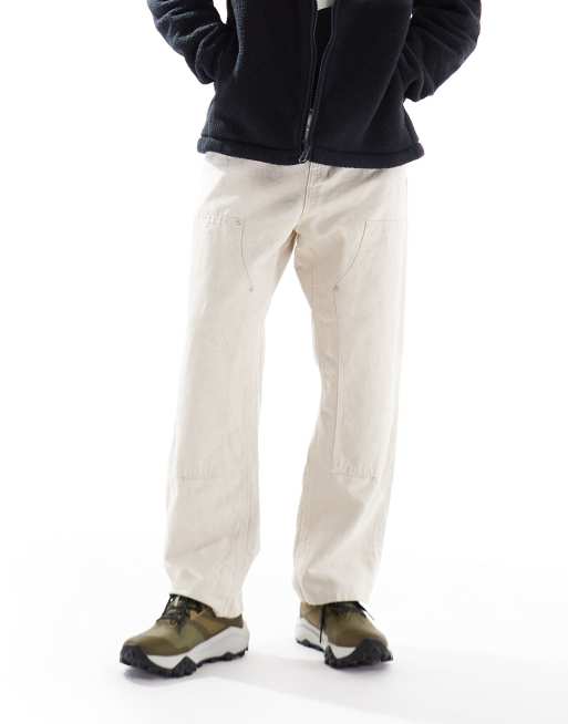 Zapatillas de deporte negras y tostadas para carrera de montaña