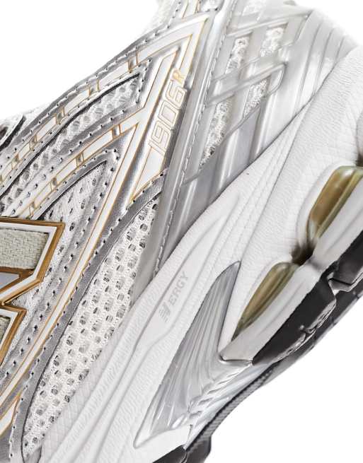 New Balance 1906 sneakers in silver and gold