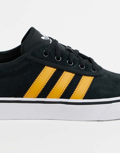 Adidas negro cheap y amarillo