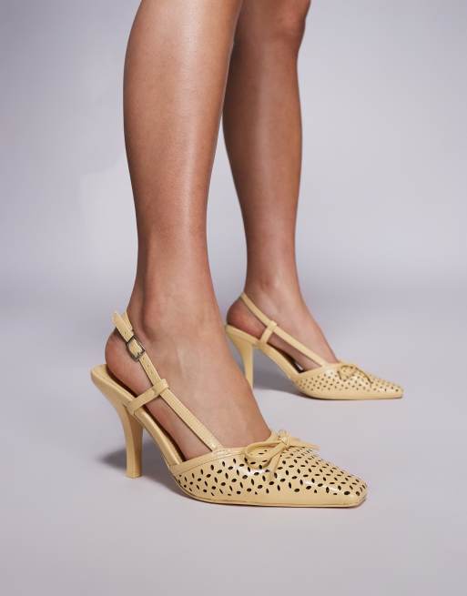 Zapatos amarillos de tacón destalonados con detalle de lazo y diseño calado a láser Alchemy de Public Desire