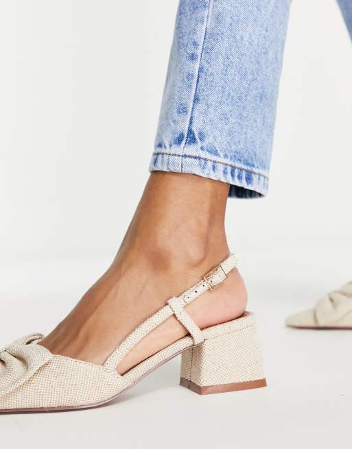 Zapatos beis destalonados con tac n medio y lazo Suzy de ASOS DESIGN