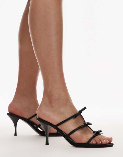 Zapatos negros de tacón sin cierres con detalle de lazo de Mango