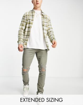 Брюки скинни Зауженные брюки цвета хаки со рваными разрезами ASOS DESIGN-Зеленый цвет