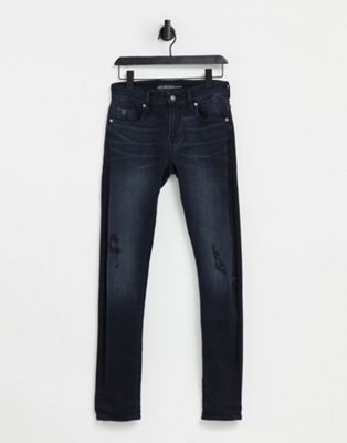 фото Зауженные джинсы цвета выбеленного индиго guess-голубой