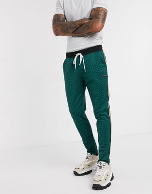 фото Зеленые брюки с геометрическим узором и атласной лентой по бокам good for nothing-зеленый