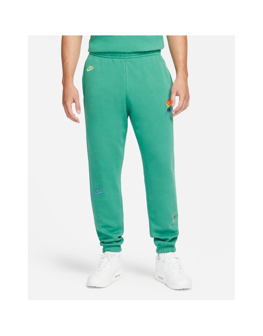фото Зеленые джоггеры в стиле casual с манжетами и несколькими логотипами nike essential fleece+ suit 11-зеленый цвет