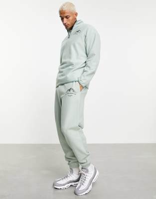 фото Зеленые флисовые oversized-джоггеры с принтом горы asos design-зеленый цвет