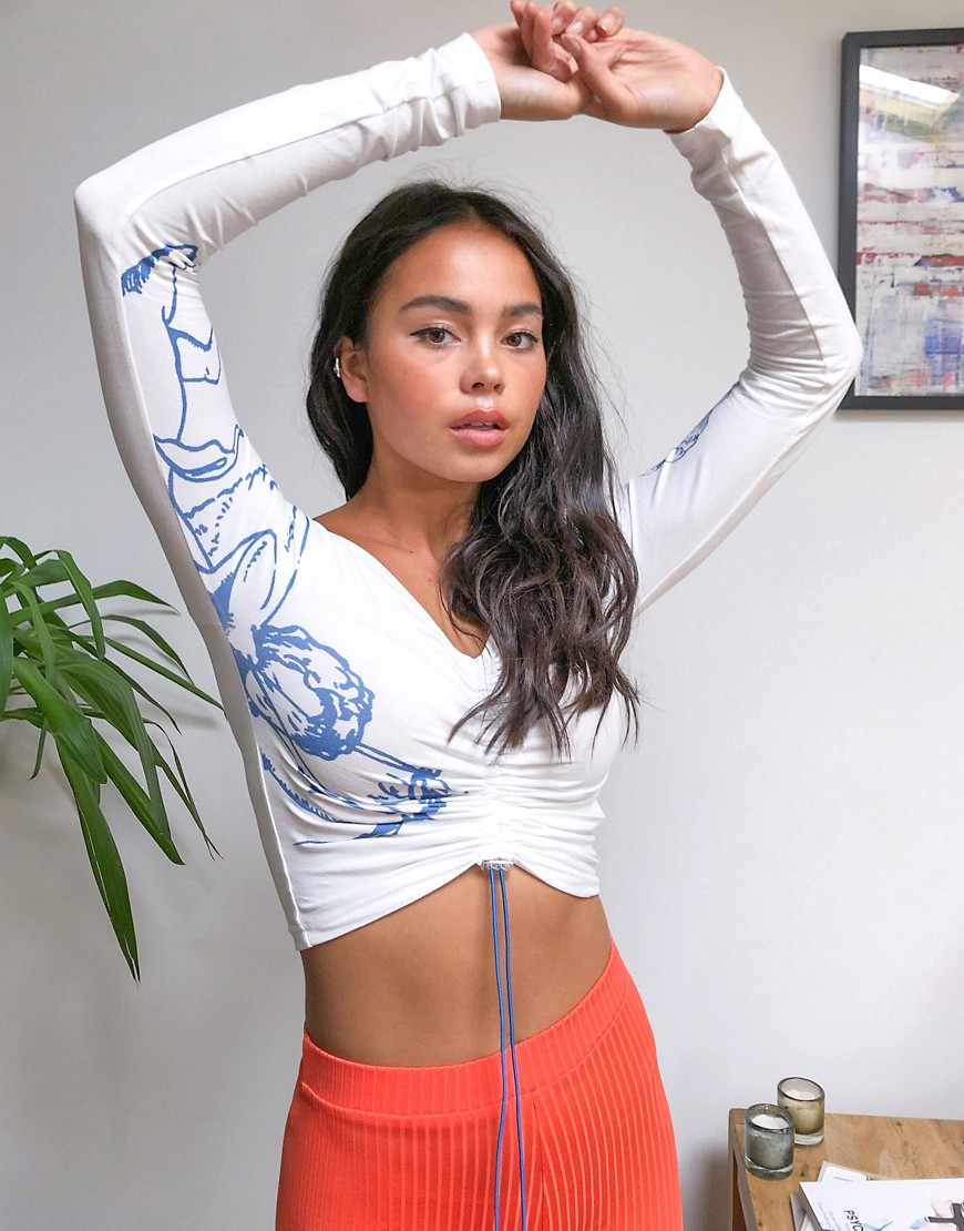 Zemeta off shoulder long sleeve crop top with tie front and cupid graphic-White