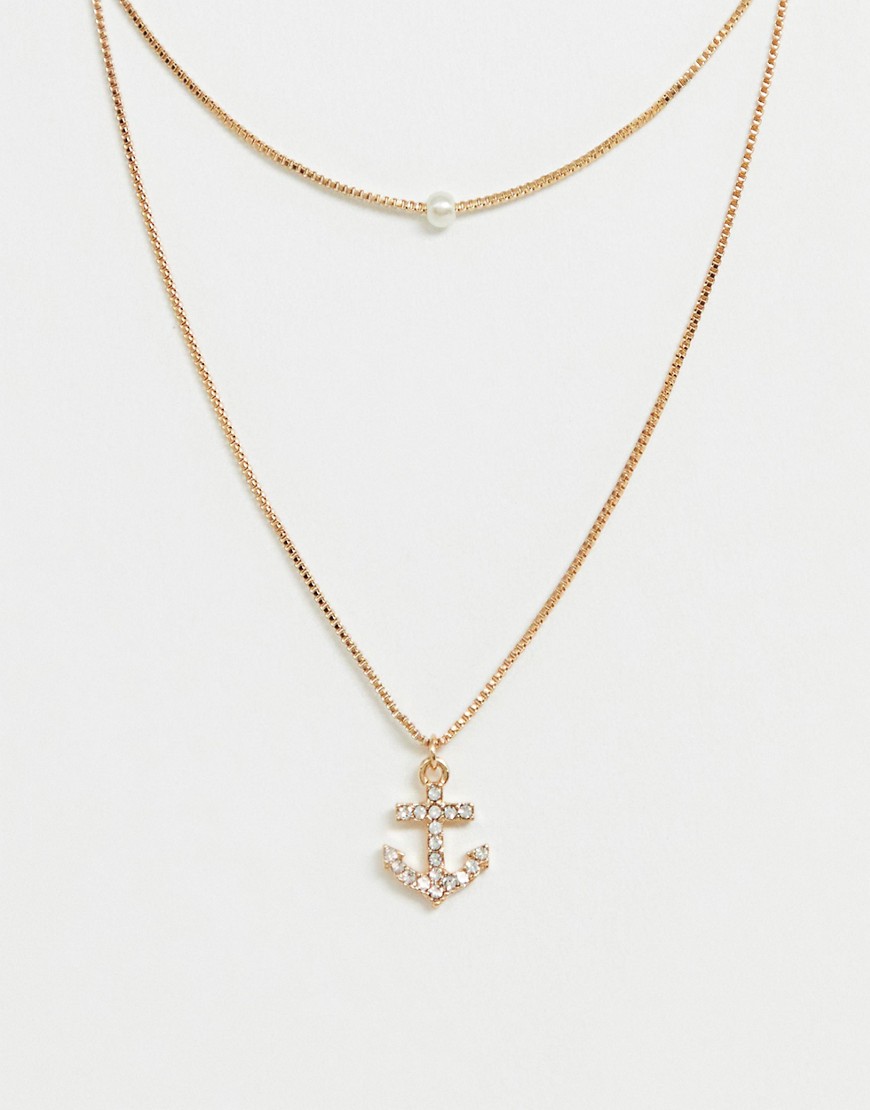 фото Золотистое ожерелье с подвеской-якорем aldo melassa-золотой